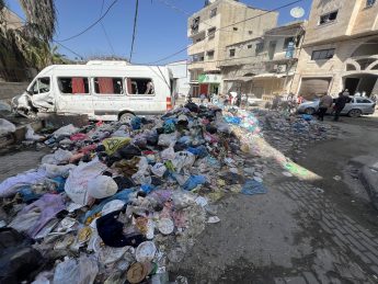 UNRWA: Huge mounds of rotting trash pile up around displacement tents