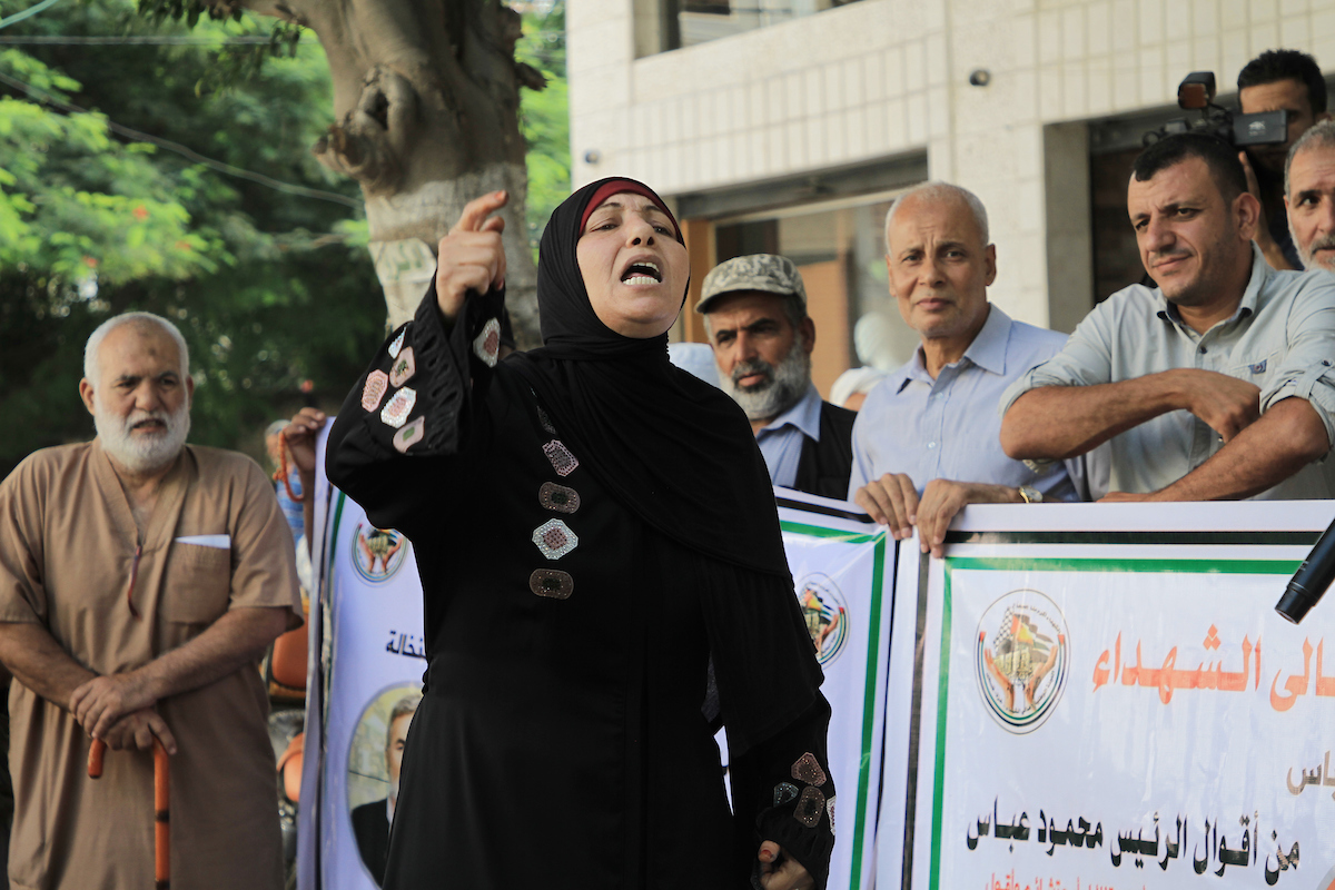 Palestinian families of the martyrs and the wounded take part in a protest against the Palestinian Authority's decision to cut their salaries in Gaza city on September 19 2023. 
