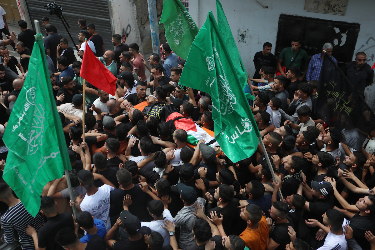On 10 September 2023 Palestinians carry the body of Milad Al-Ra'i killed by Israeli occupation forces during his funeral in Al-Aroub refugee camp north of the West Bank city of Hebron. Israeli forces shot dead at least 16 Palestinians in September 2023.